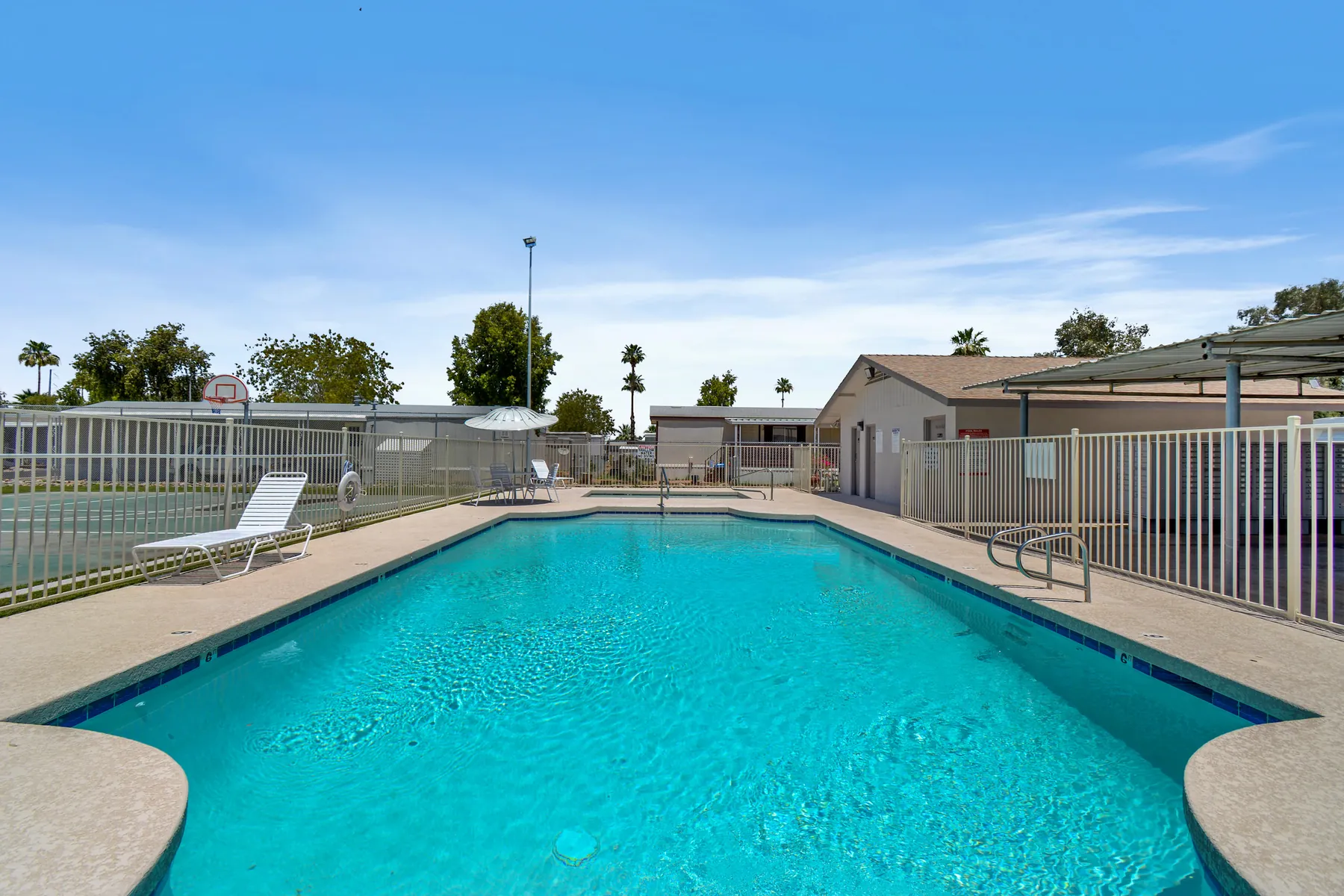 Swimming pool with loungers and umbrellas