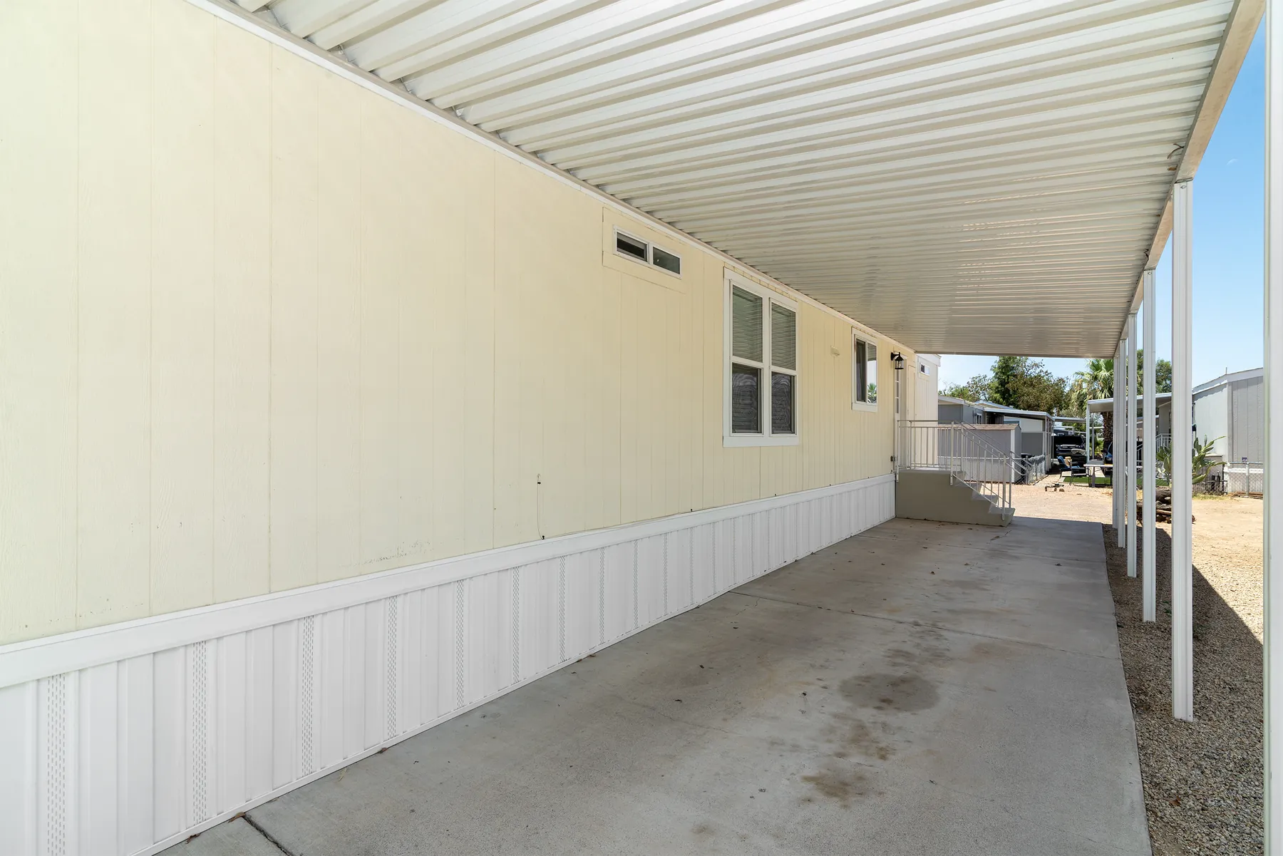 Covered carport looking toward the entry steps