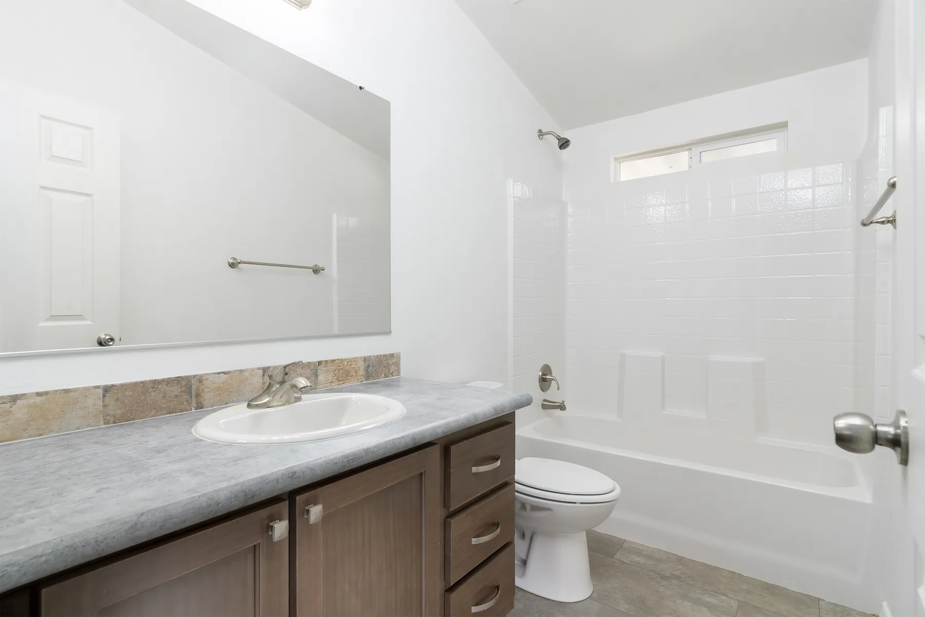 Guest bathroom with vanity and tub shower